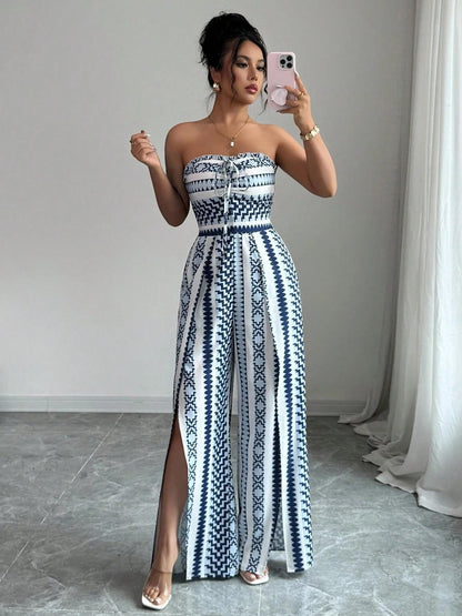 👗💙 Geometric jumpsuit with halter neckline and side slit!