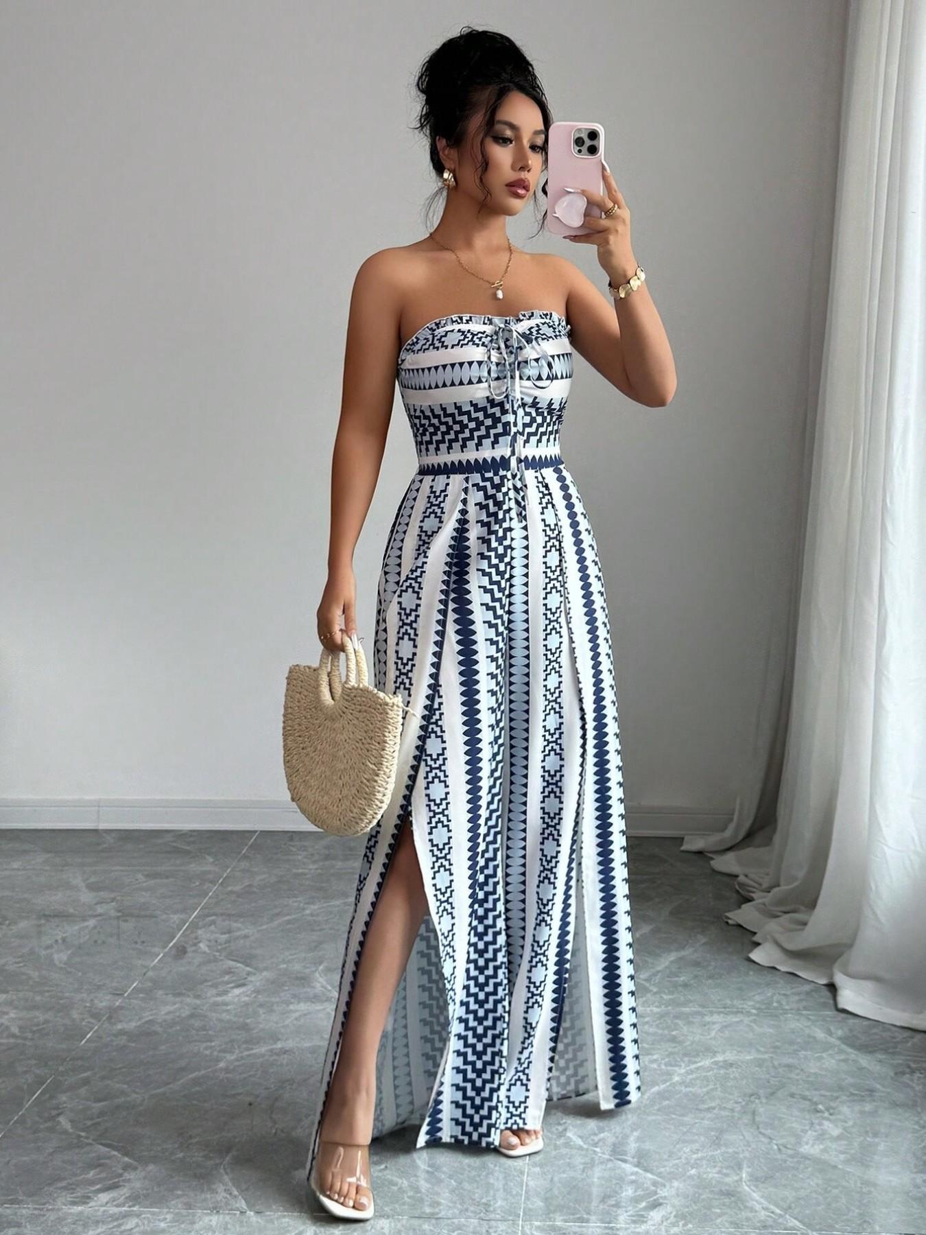 👗💙 Geometric jumpsuit with halter neckline and side slit!