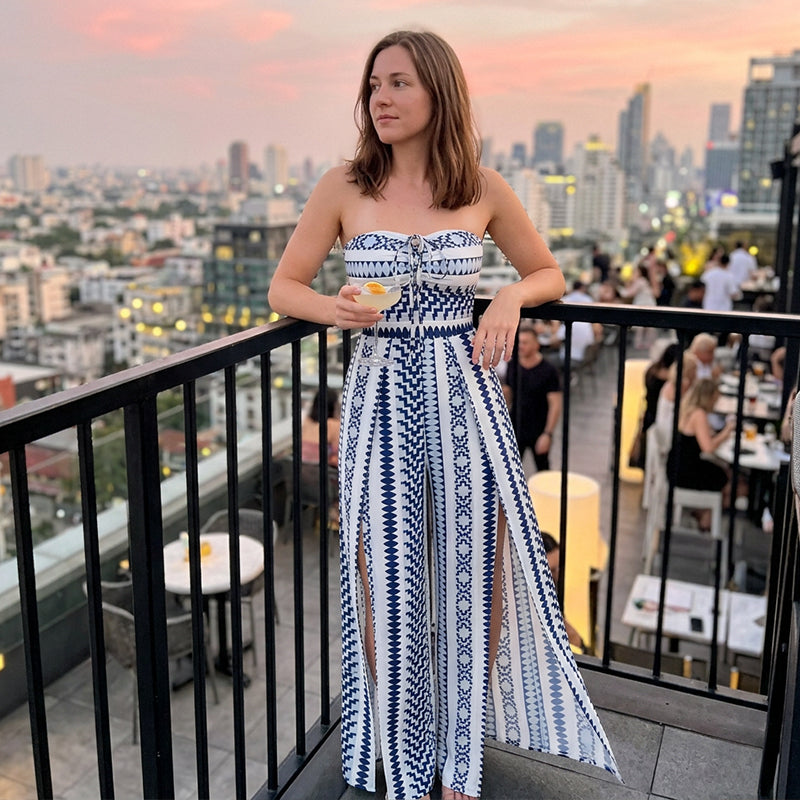 👗💙 Geometric jumpsuit with halter neckline and side slit!