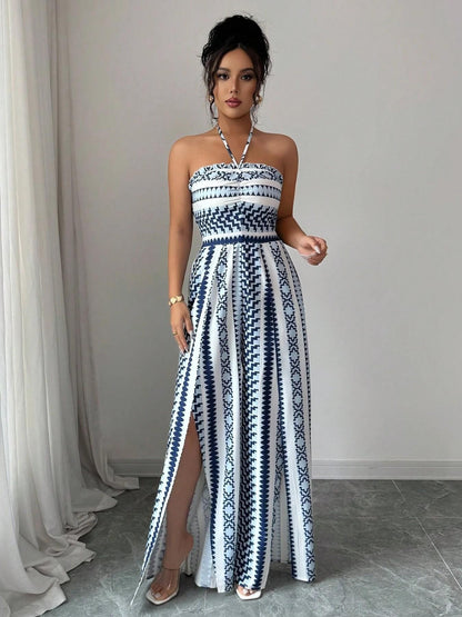 👗💙 Geometric jumpsuit with halter neckline and side slit!