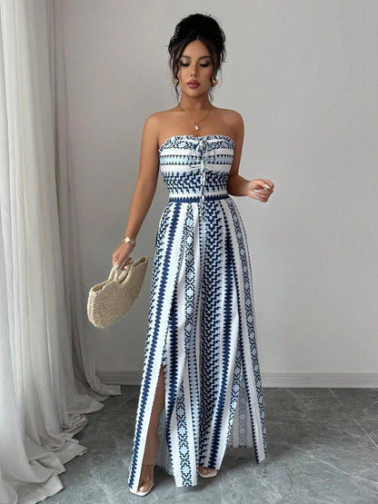 👗💙 Geometric jumpsuit with halter neckline and side slit!