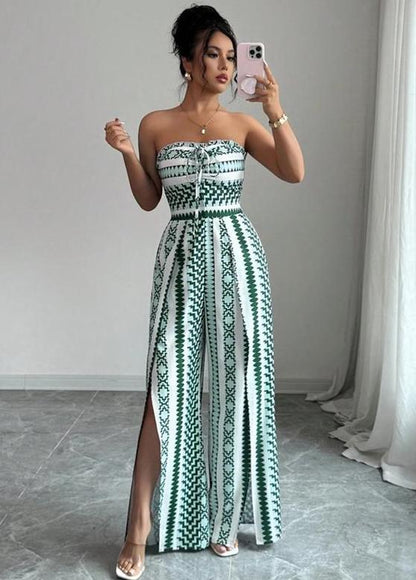 👗💙 Geometric jumpsuit with halter neckline and side slit!